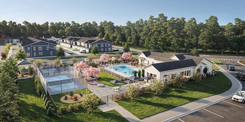 A bird's eye view of a residential area with houses, a pool, and a playground.