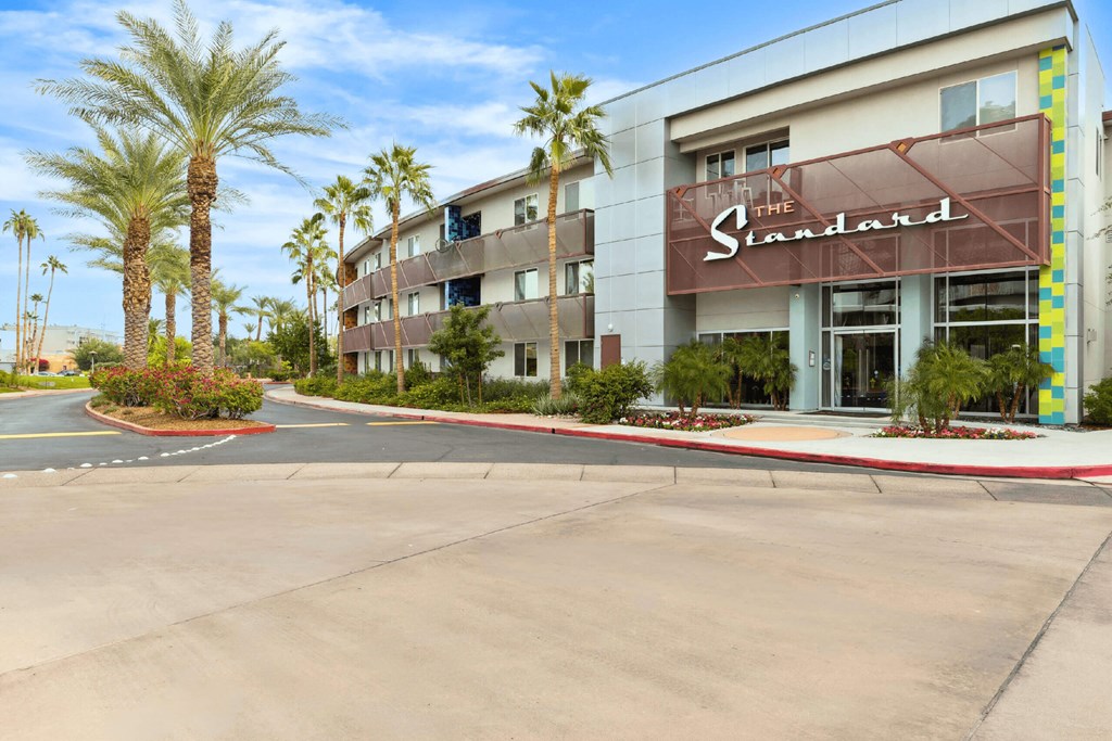The Standard hotel has a parking lot in front of it.