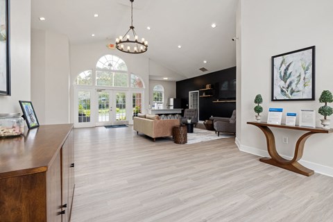 clubhouse with a sitting area, a TV and a kitchen area