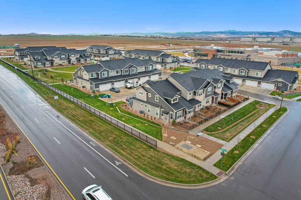 a group of houses on the side of a street