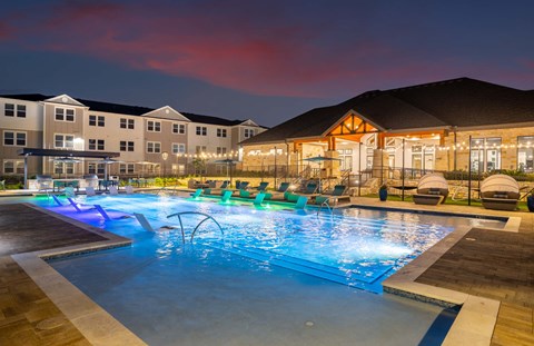 a swimming pool at night at the residences at the estates at night