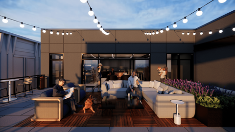 A man and a woman are sitting on a couch in a modern outdoor living space.