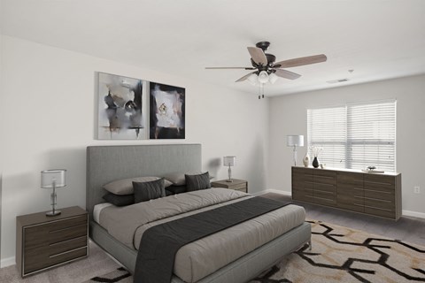 a bedroom with a bed and dresser