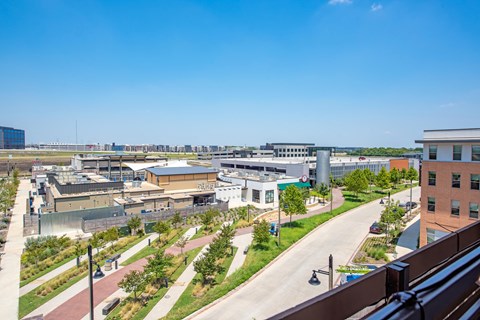 a view of the city from the balcony of a building