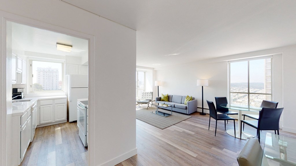 a kitchen and living room in an apartment