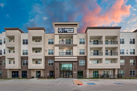 A building with a sign that says "apine" in front of it.