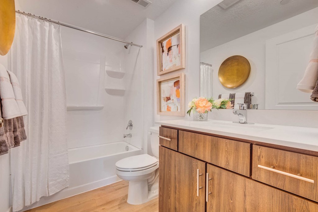 a bathroom with a toilet sink and bathtub