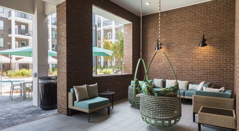 the lobby of a hotel with couches and chairs