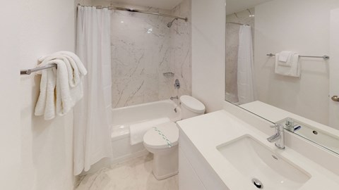 a bathroom with a sink toilet and bathtub