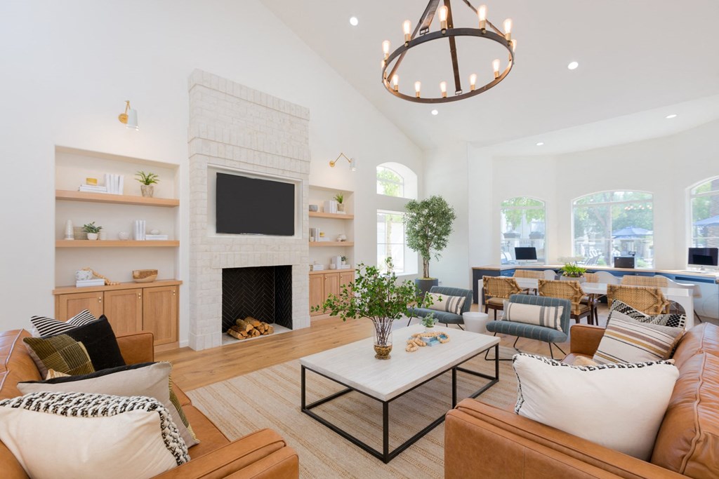 a living room filled with furniture and a fireplace