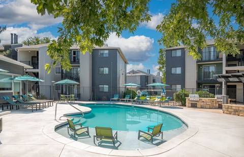 Pool With Relaxing Chairs at Terra Vista at the Park Apartments, Colorado, 80123