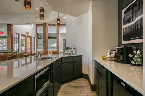 a kitchen with a counter top and a sink