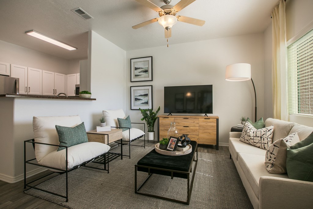 A Living Room With a Couch and TV at Cantata at the Trails, Albuquerque, 87114