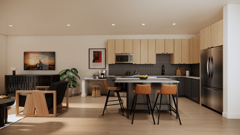 A modern kitchen with a dining table and chairs.