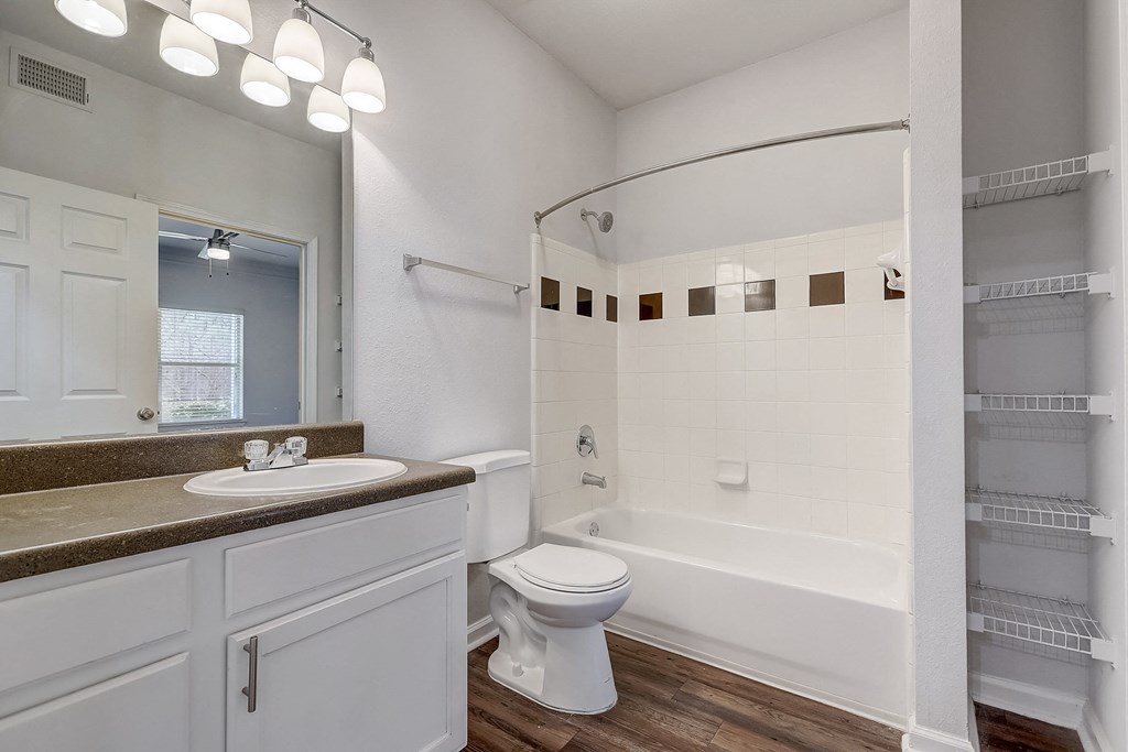 a bathroom with a toilet sink and bathtub