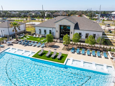 A pool with a building behind it.