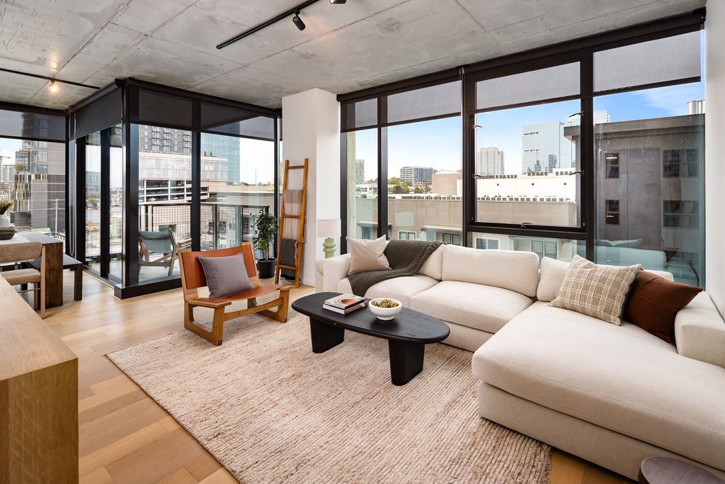 a living room with a white couch and a coffee table