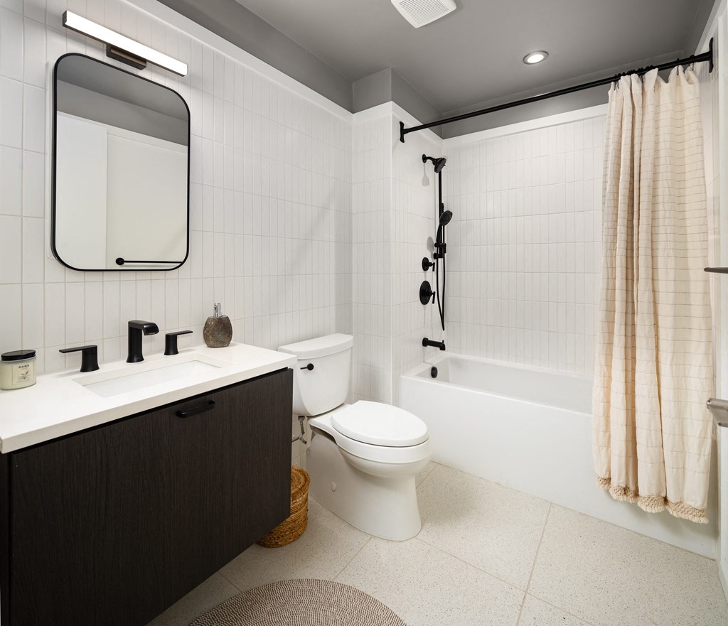 a bathroom with a toilet sink and a shower