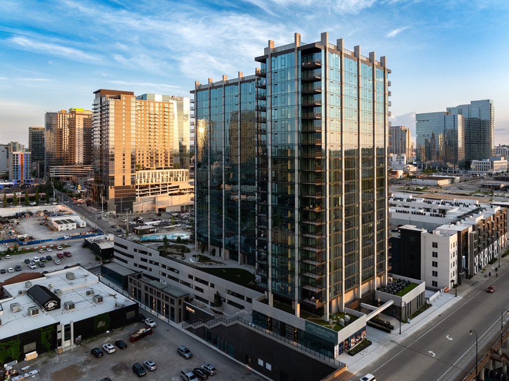 an aerial view of a tall building in a city