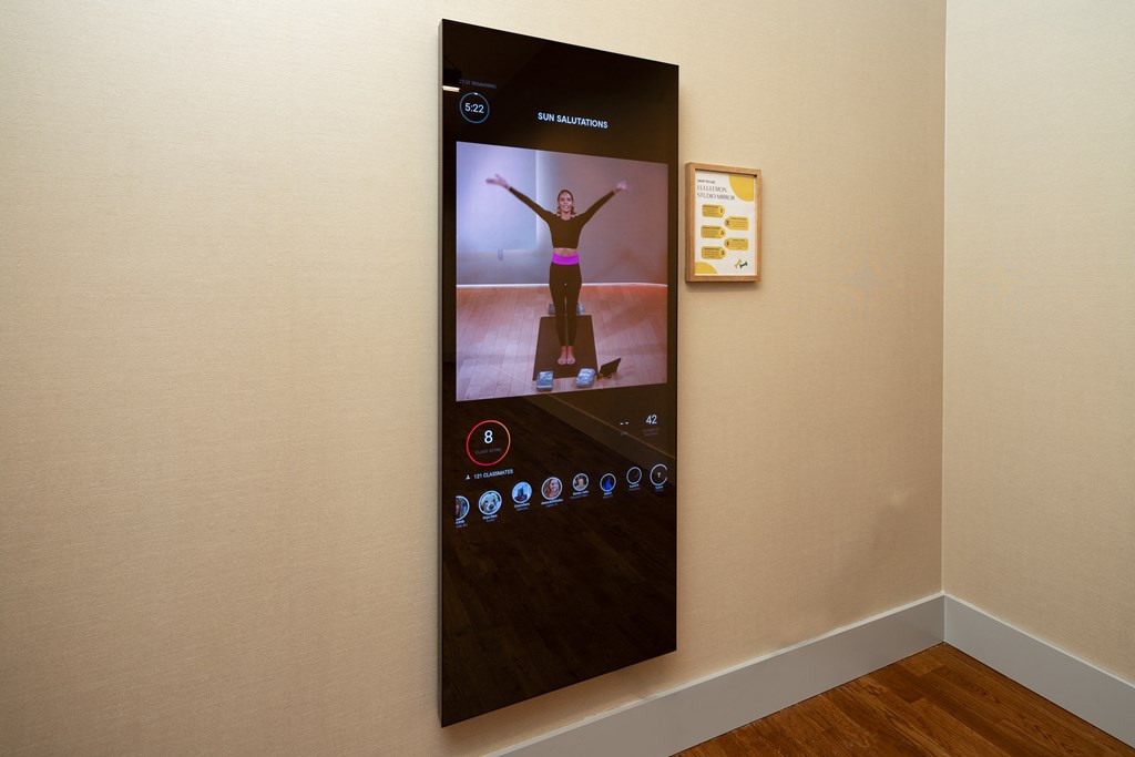 a large screen on a wall with a picture of a person on a skateboard