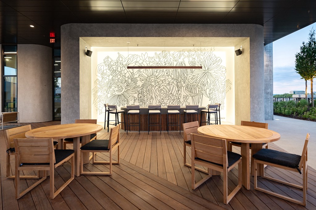 a rendering of a patio with tables and chairs