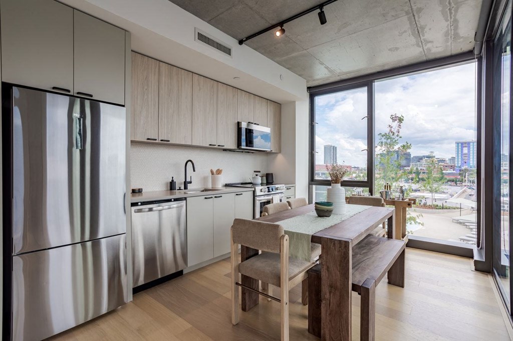 a kitchen and dining room with a city view