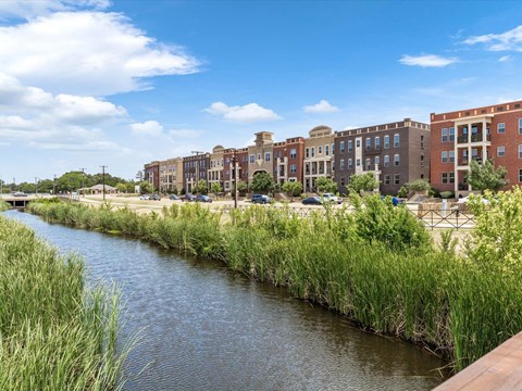 a river running through a city with tall buildings