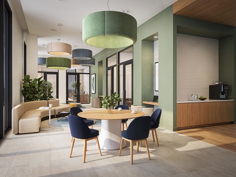 A modern dining room with a round table and chairs.