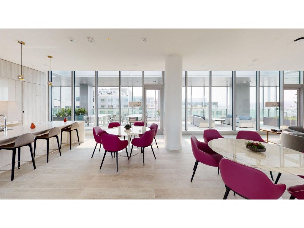 a large room with a table and chairs