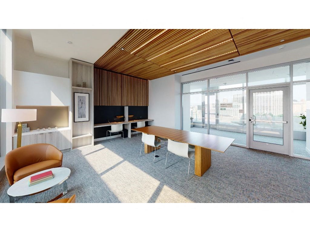 a room filled with furniture and a large window