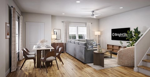 A well-lit living room with a dining table and a couch.