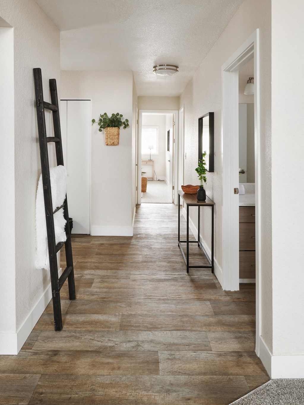 a view of the hallway in a 555 waverly unit with hardwood floors and a