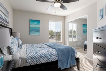 Sunny & Bright Bedroom with a large bed and a ceiling fan at Village Square, California