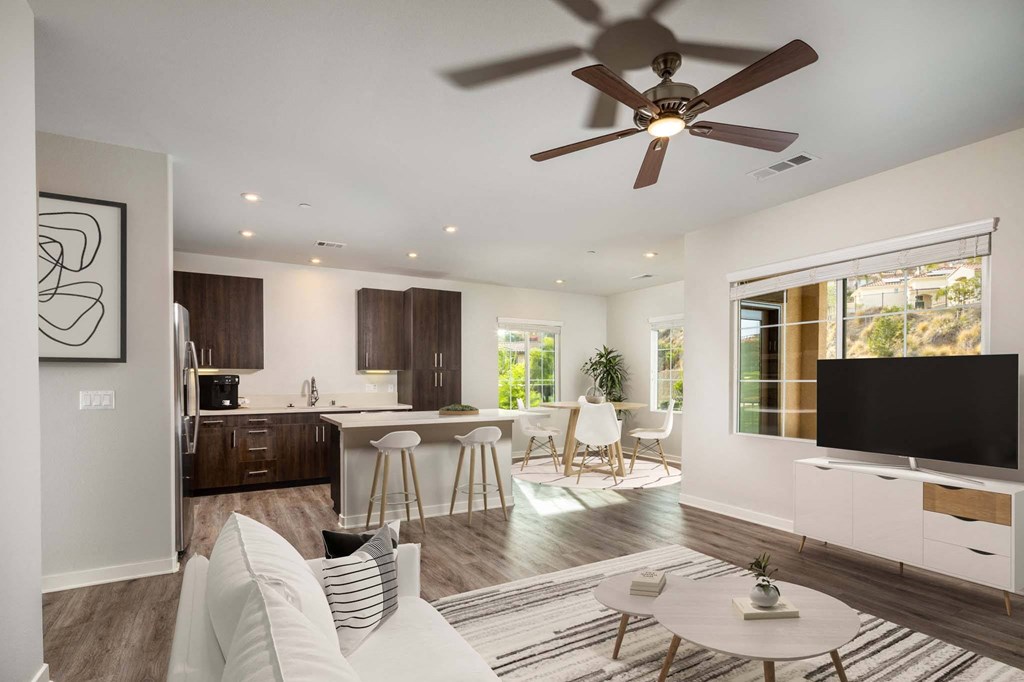 Living room with a ceiling fan and a kitchen in the background  at Lakeview 88, Spring Valley, CA