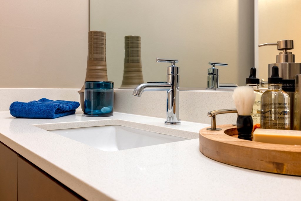 a bathroom with a sink and a mirror