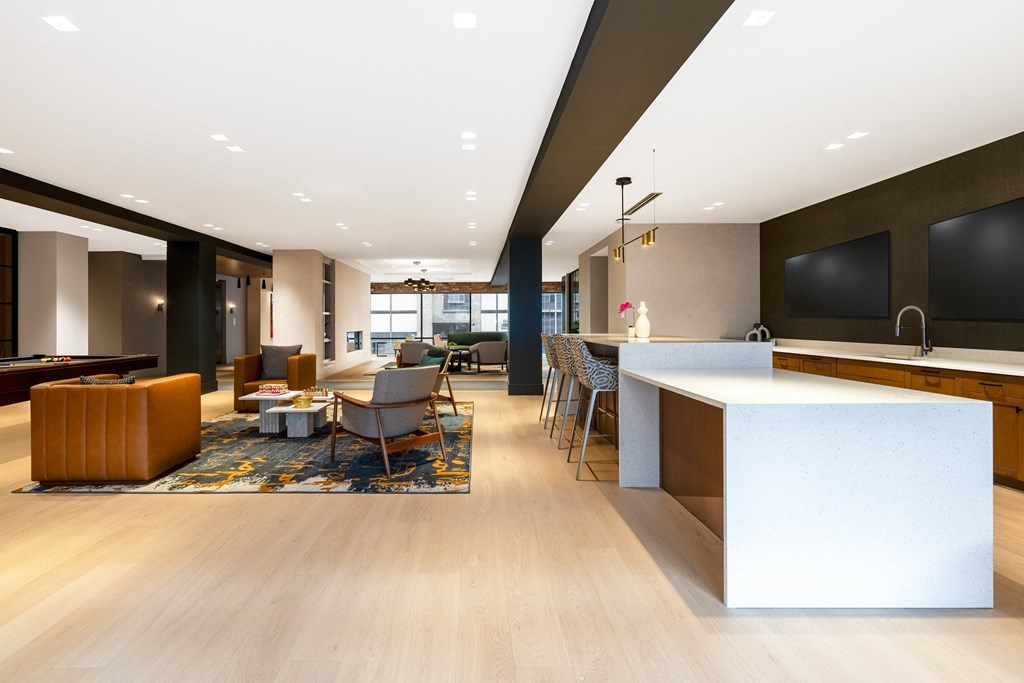 a large living room with a kitchen and a dining room