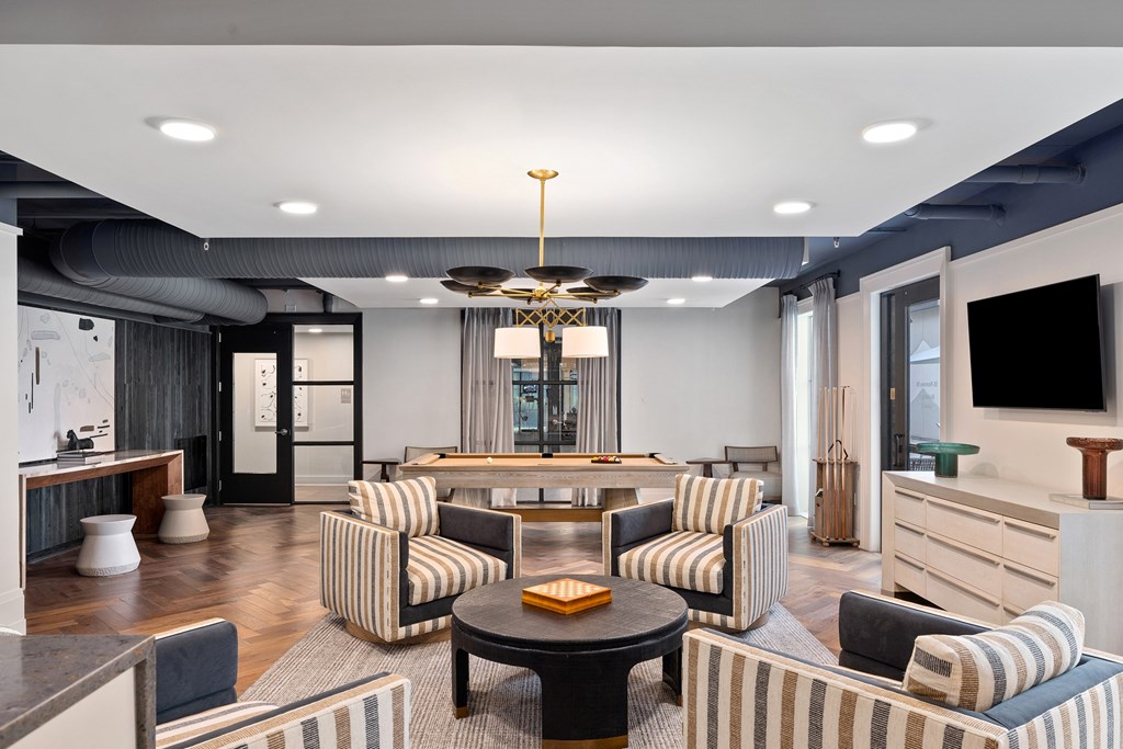 A modern living room with a striped sofa and a coffee table.