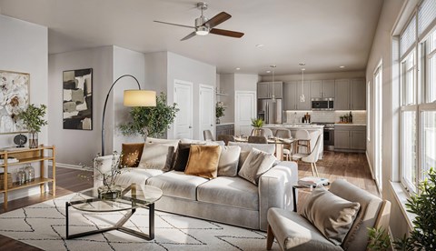 A modern living room with a grey sofa and a coffee table.
