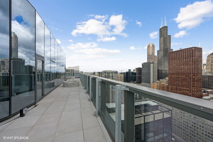 a view of the skyline from a rooftop terrace
