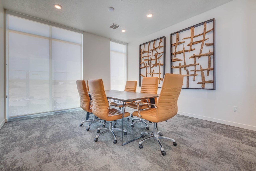 a conference room with a table and chairs