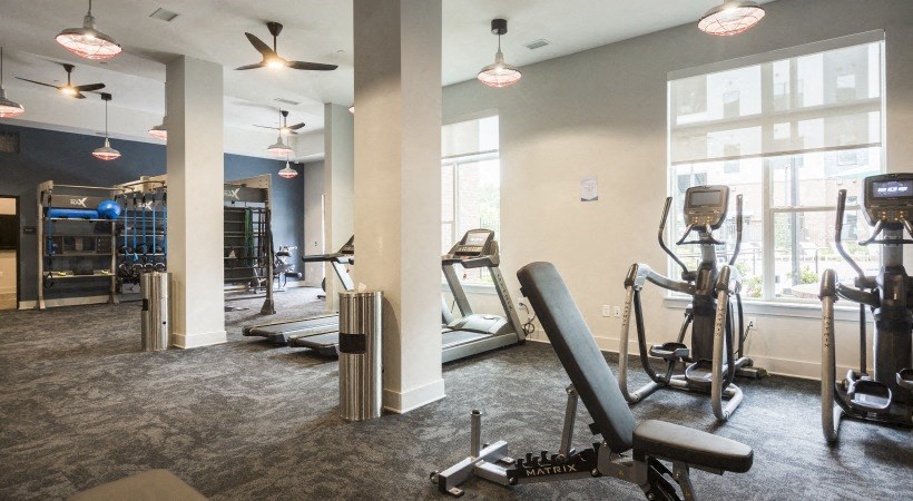 the gym at the district flats apartments in lenexa