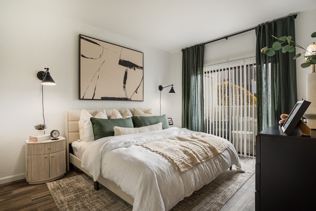 a bedroom with a bed and a window