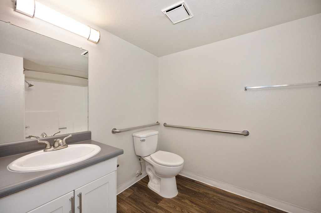 a studio apartment bathroom with a toilet and a sink