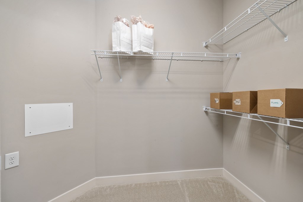 A storage room with shelves and boxes.