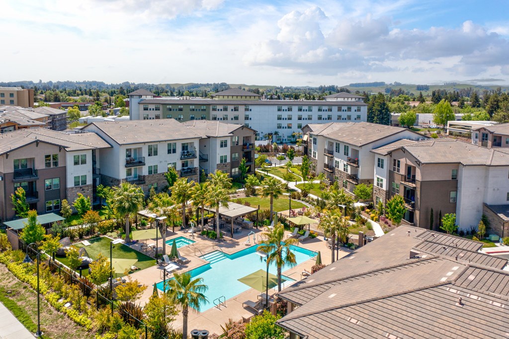 an aerial view of the resort style pool at the bradley braddock road station apartments