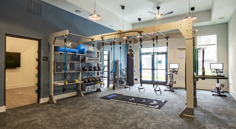 a boxing gym with punching bags and punching bags hanging from the ceiling
