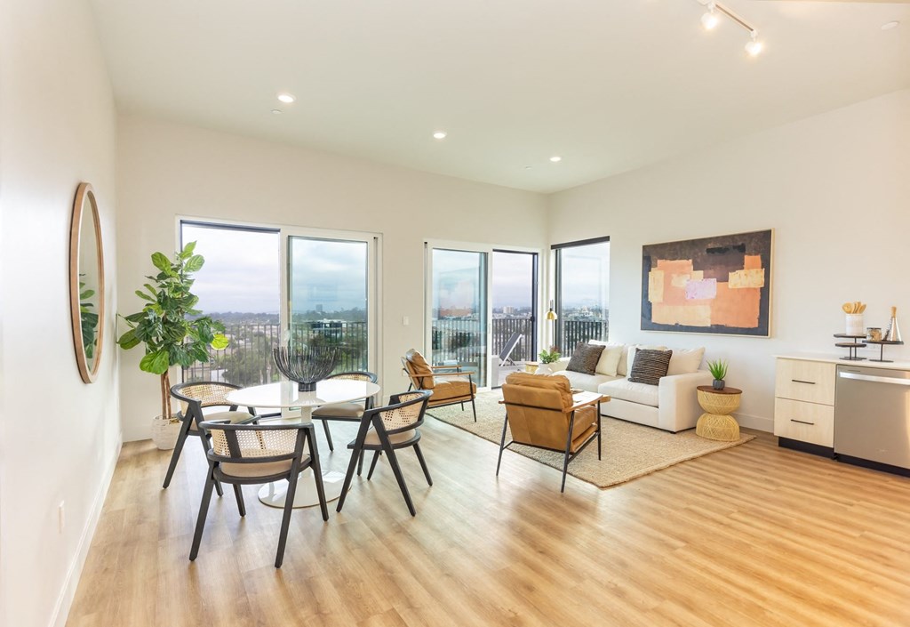 a living room with a table and chairs and a couch