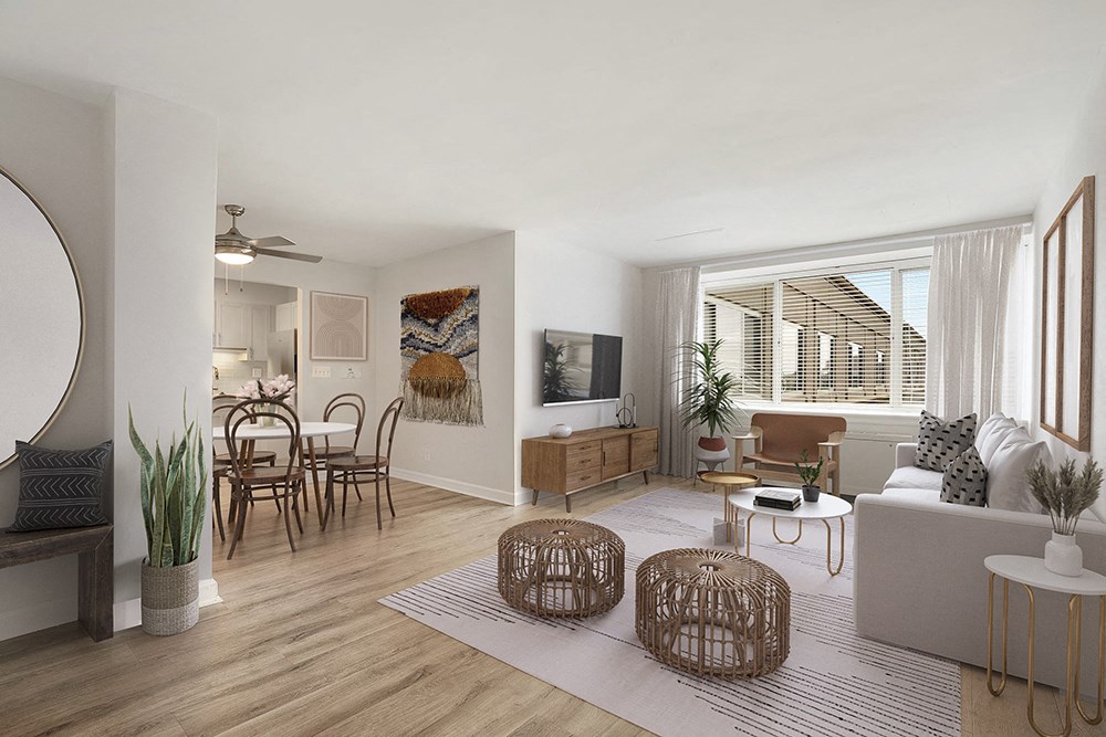 a living room and dining room with a couch and a table