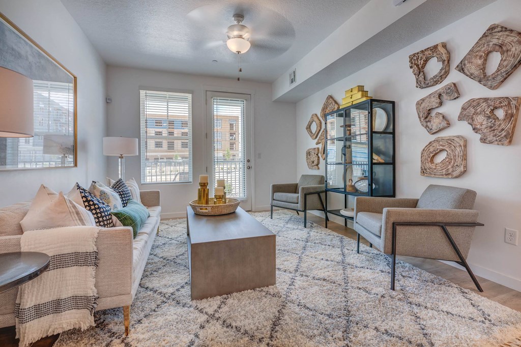 a living room with a couch coffee table and chairs