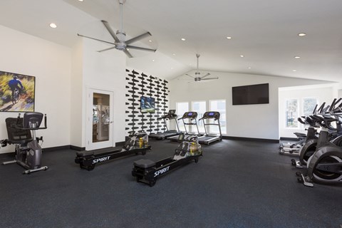 Fitness center with rowing machines and treadmills at Brookside112 Apartments, Washington